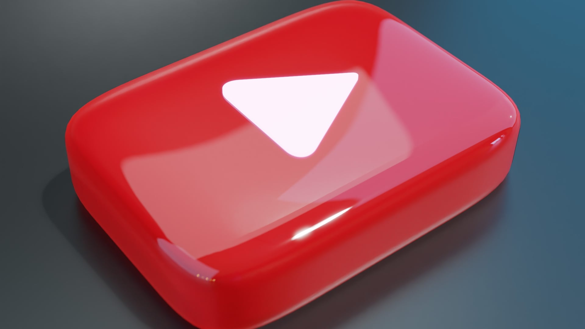 Glossy rendering of YouTube's red button with a white Play symbol
