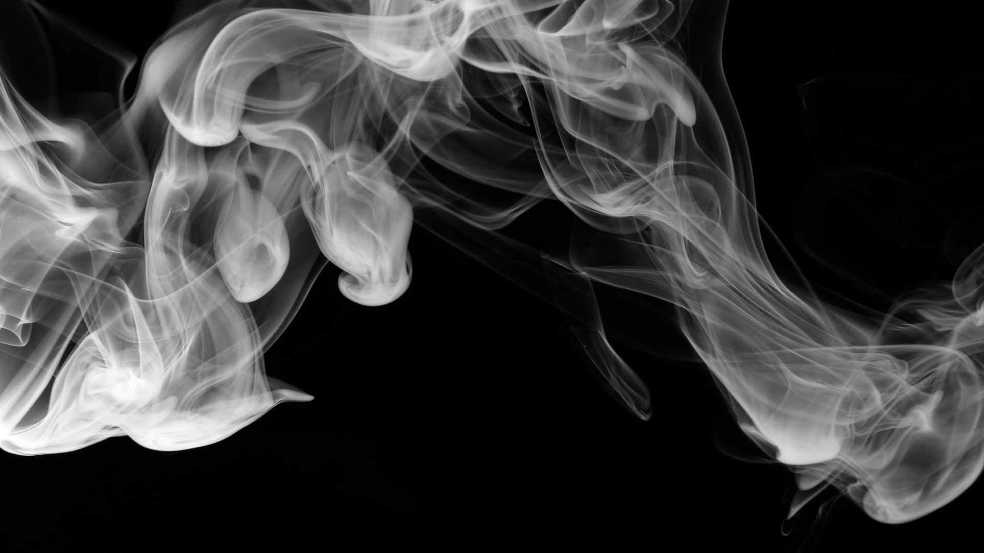 Closeup of some smoke, set against a solid black background