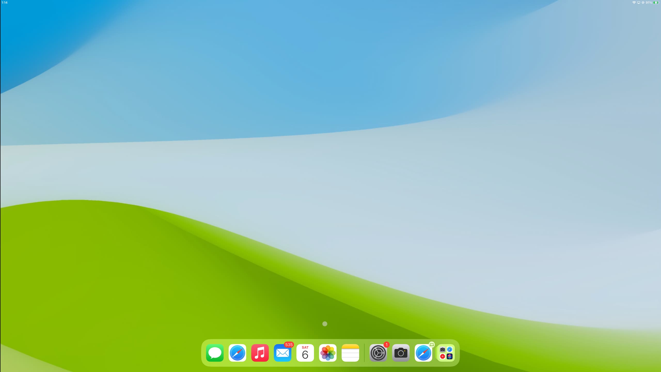iPad desktop without Home Screen app icons visible on the connected monitor