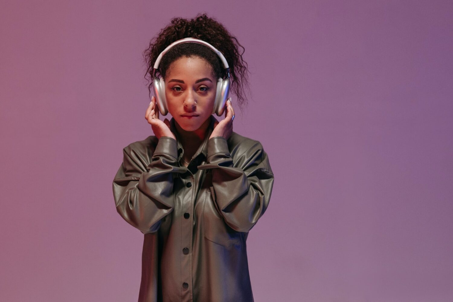 Woman wearing AirPods Max headphones