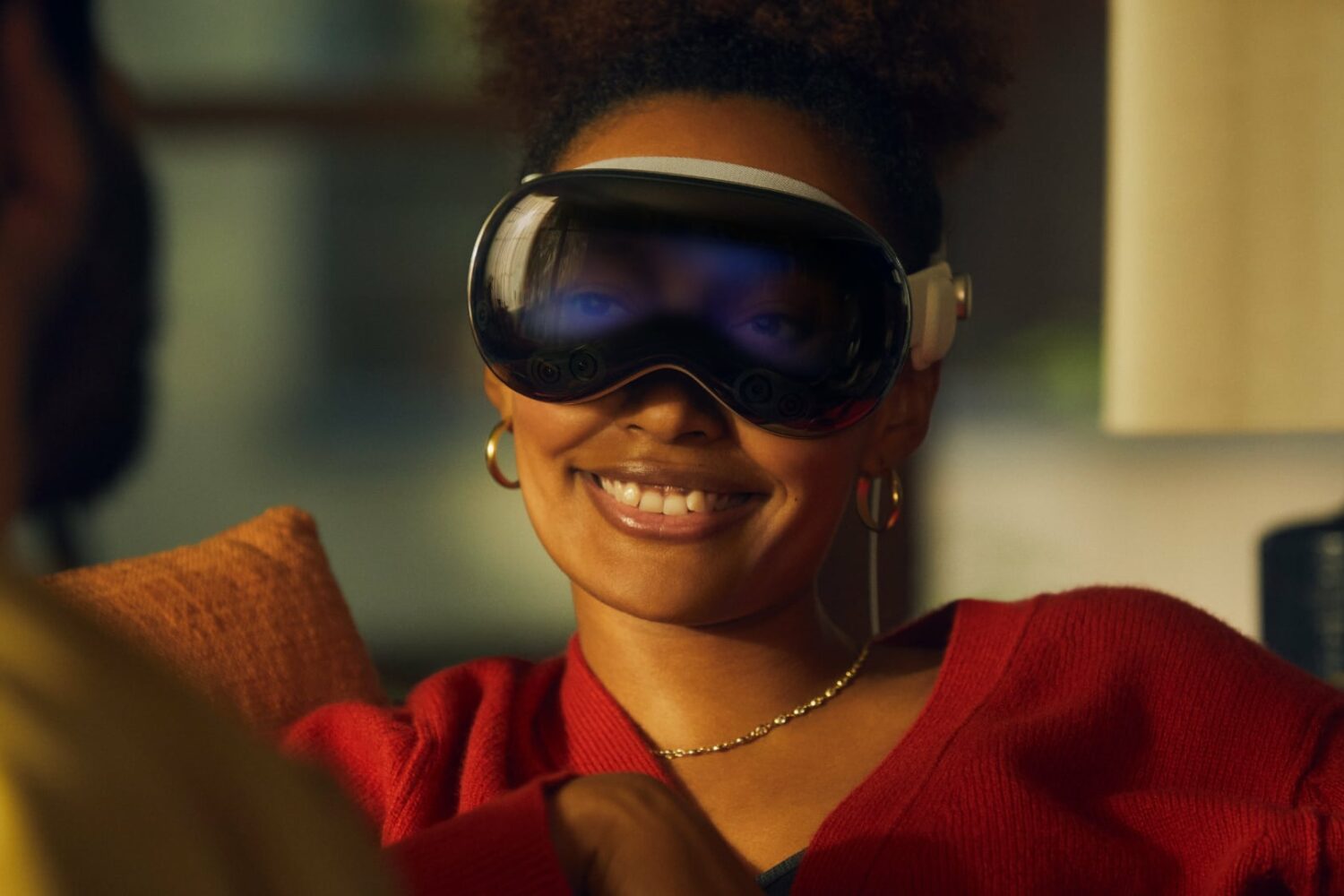 Woman wearing Apple's Vision Pro headset with her digital eyes showing on the front