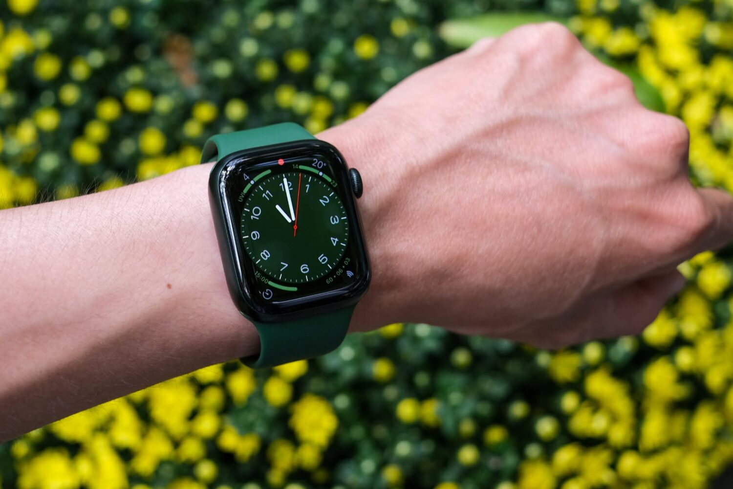 Green Apple Watch Series 7 worn on a male wrist