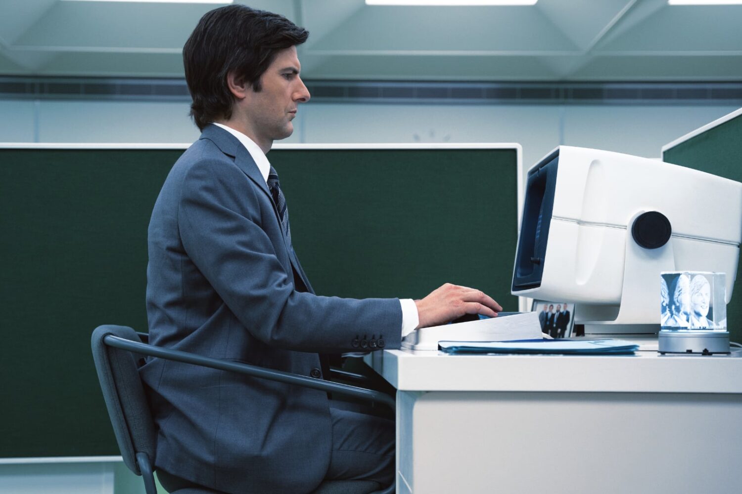Mark Scout sitting in front of his computer at Lumon Industries in "Severance"