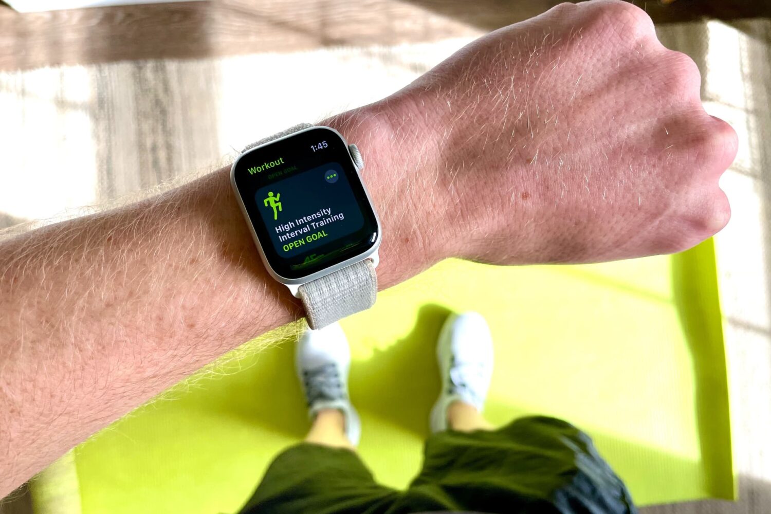 Apple Watch Series 6 on a trainee's wrist with a HIIT session selected