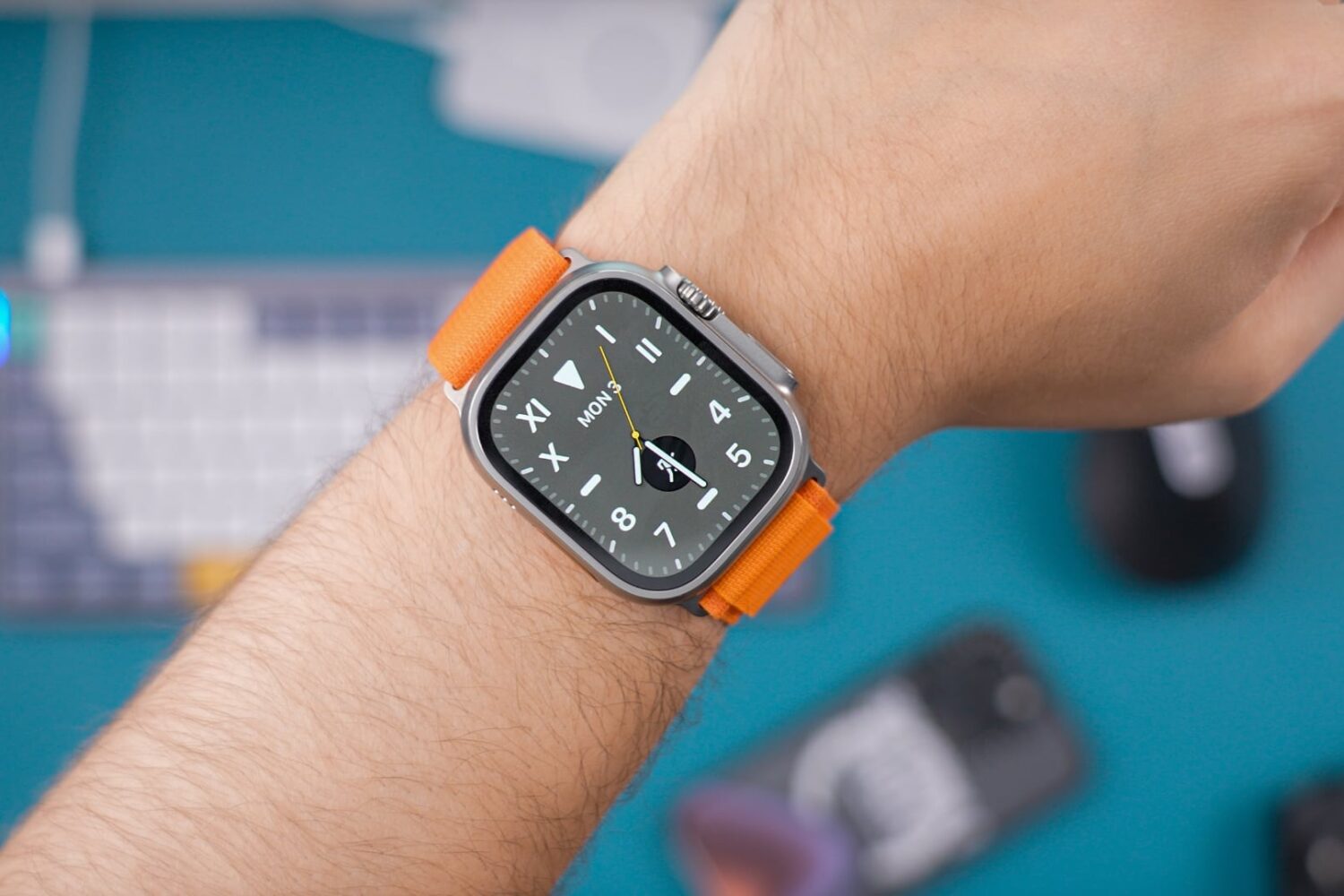 Apple Watch Ultra with Orange Band on male wrist