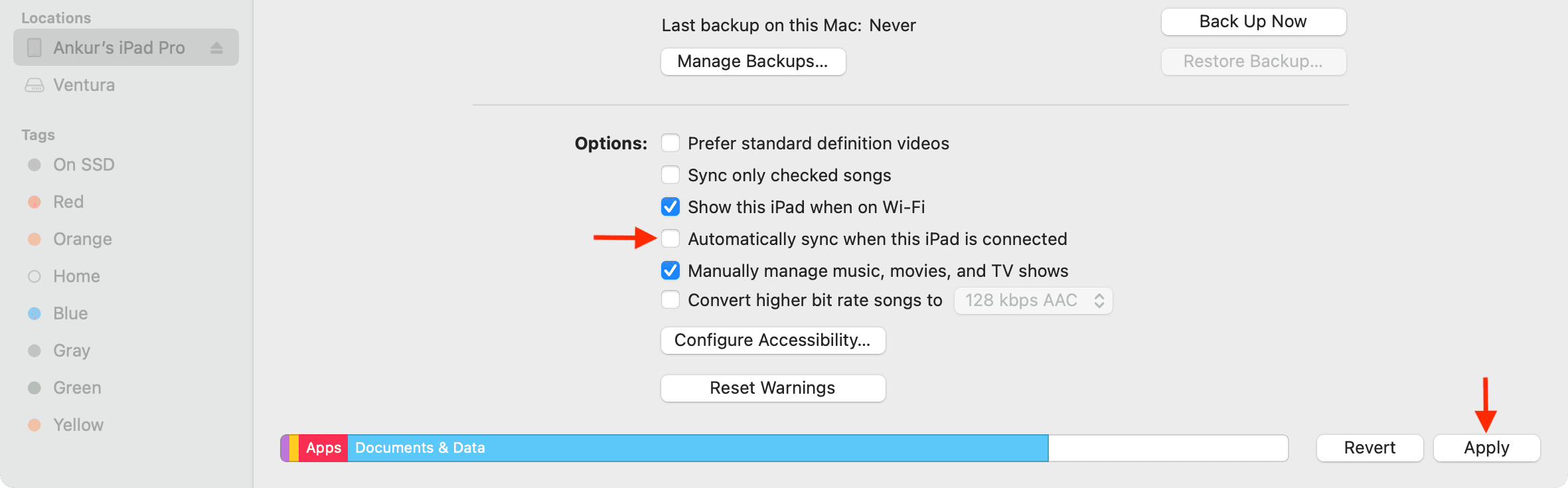 Uncheck Automatically sync when this iPhone or iPad is connected in Finder on Mac