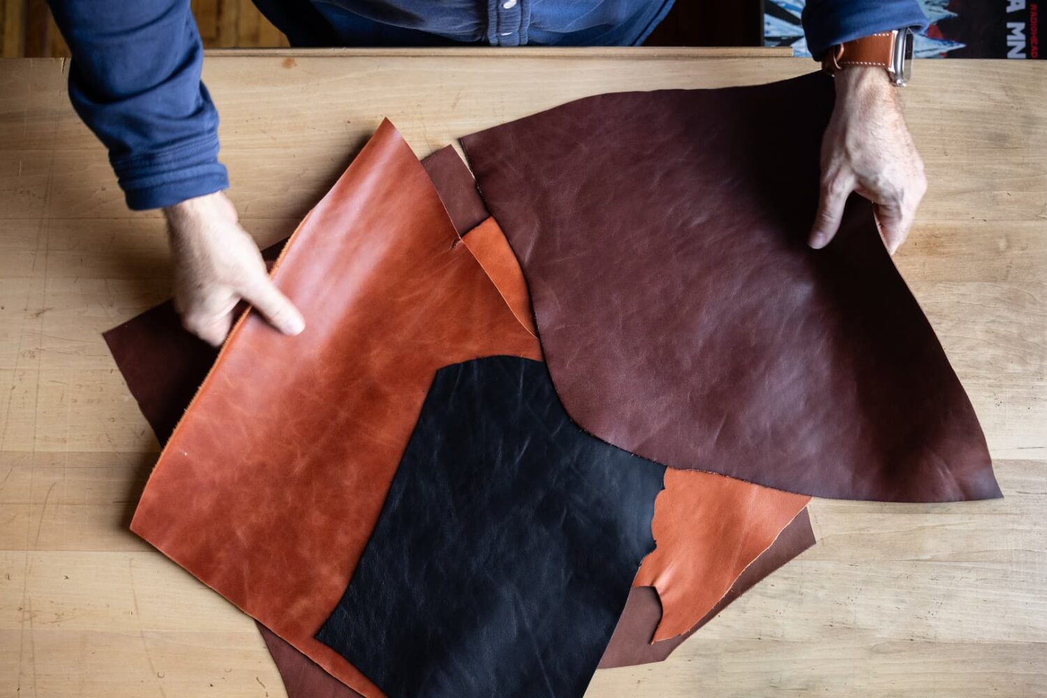 Male hands showcasing various leather color samples