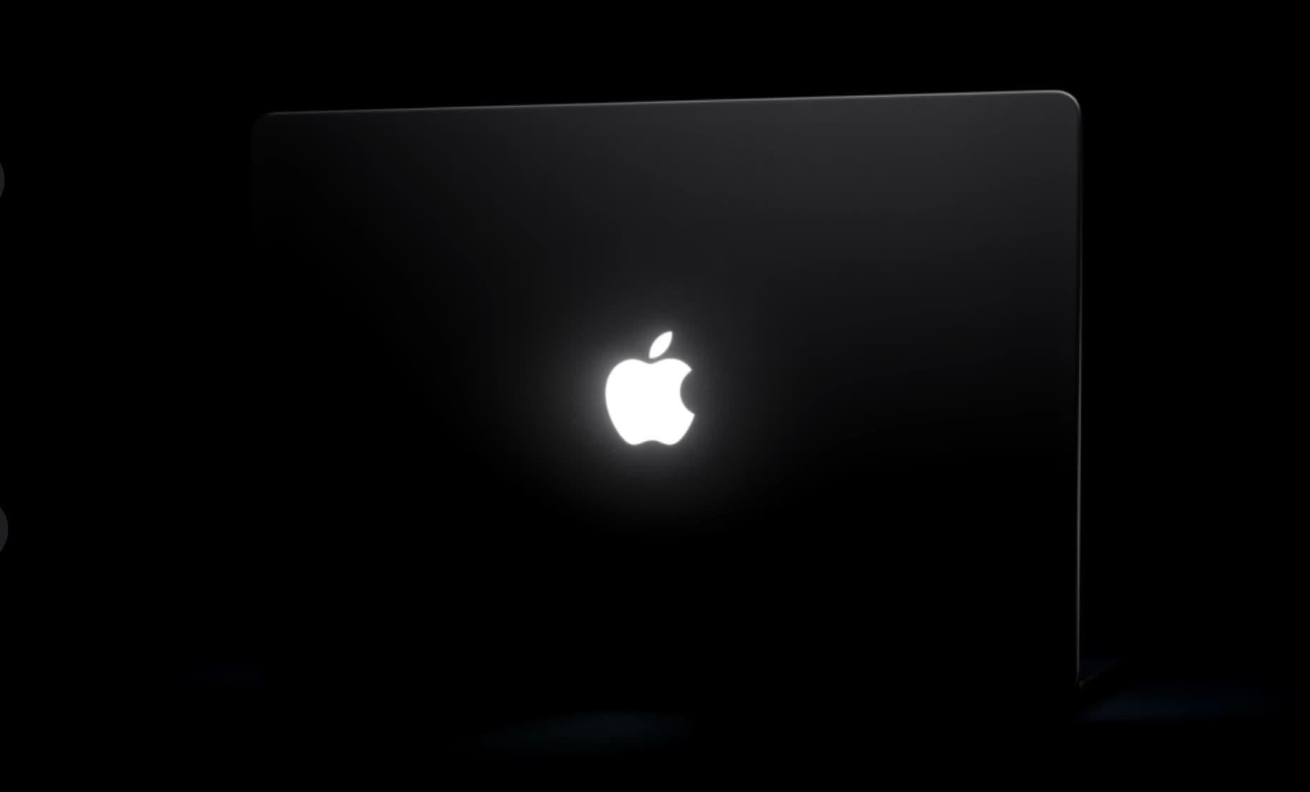 Glowing Apple logo on back of display of touchscreen MacBook Pro